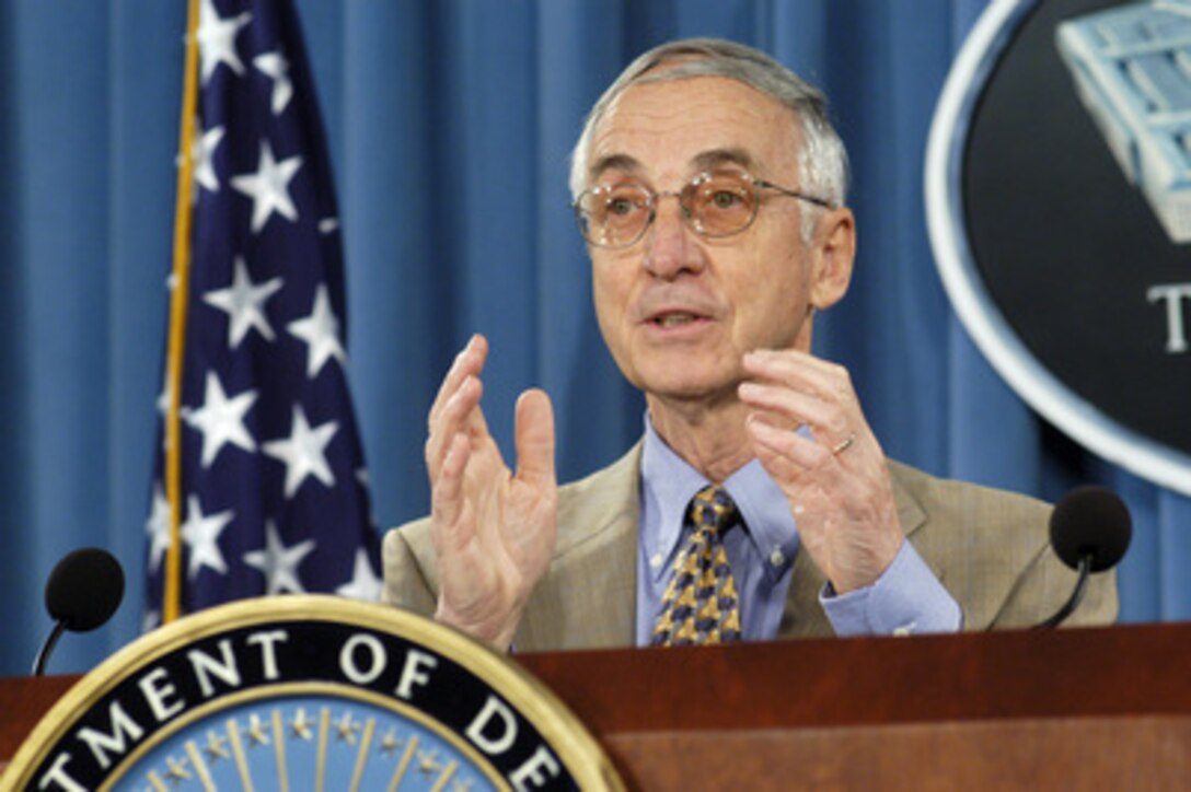 Secretary of the Navy Gordon England explains to reporters at the Pentagon some of the details of how the Combatant Status Review Tribunal being established at the U.S. Naval Base, Guantanamo Bay, Cuba, will work during a press briefing on July 9, 2004. England has been directed to inform the nearly 600 detainees from the war on terrorism of their right to contest their captivity before the tribunal. A tribunal of three U.S. military officers will determine in each case what evidence can be provided. 