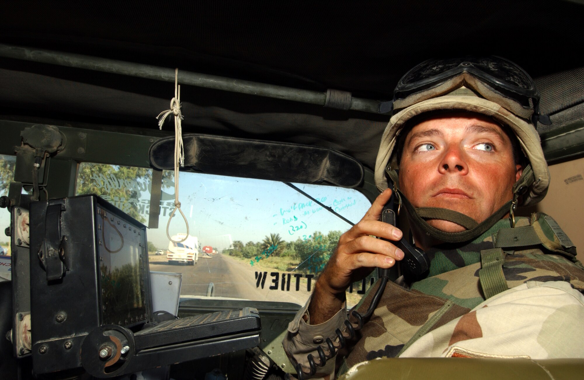 IRAQ -- Master Sgt. Theron Jones monitors the progress of a 67-vehicle convoy along the main supply route between Baghdad and Tikrit.  He and other Airmen of the 2632nd Air Expeditionary Force Transportation Company provide security to military and civilian convoys as they move supplies to forward-deployed locations throughout Iraq.  (U.S. Air Force photo by Tech. Sgt. Scott Reed)