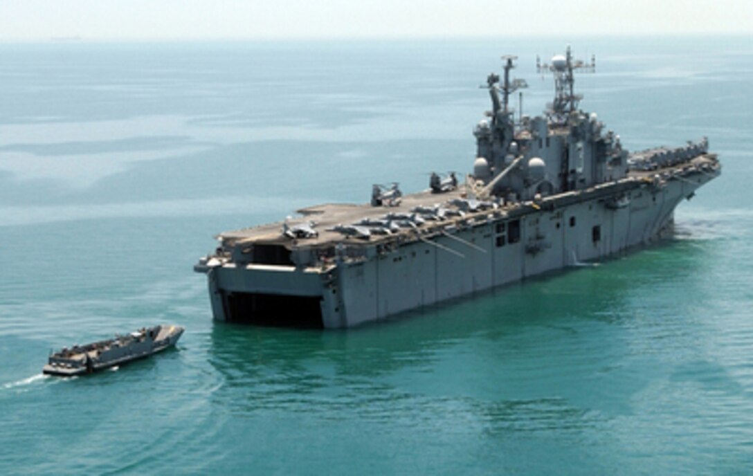 A Landing Craft Utility returns to the well deck of USS Belleau Wood (LHA 3) during a Marine Expeditionary Unit offload on July 7, 2004. The landing craft is transporting Marines, vehicles and their gear to the shores of Kuwait. 
