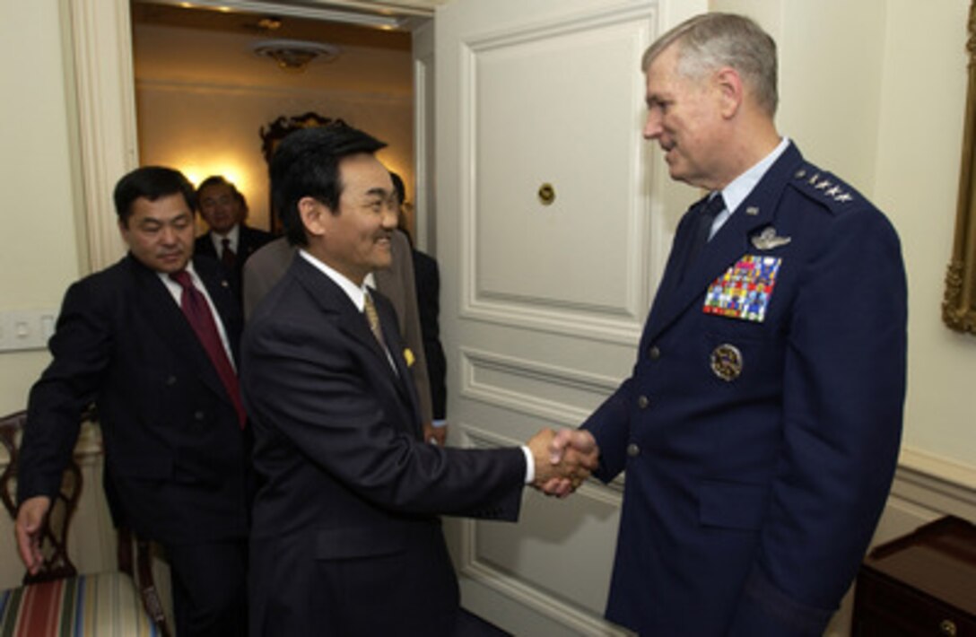 President of Mongolia Natsagiyn Bagabandi (left) is greeted by Chairman of the Joint Chiefs of Staff Gen. Richard B. Myers on July 15, 2004. Bagabandi was at the Pentagon to discuss defense issues of mutual interest with Myers and Secretary of Defense Donald H. Rumsfeld. 