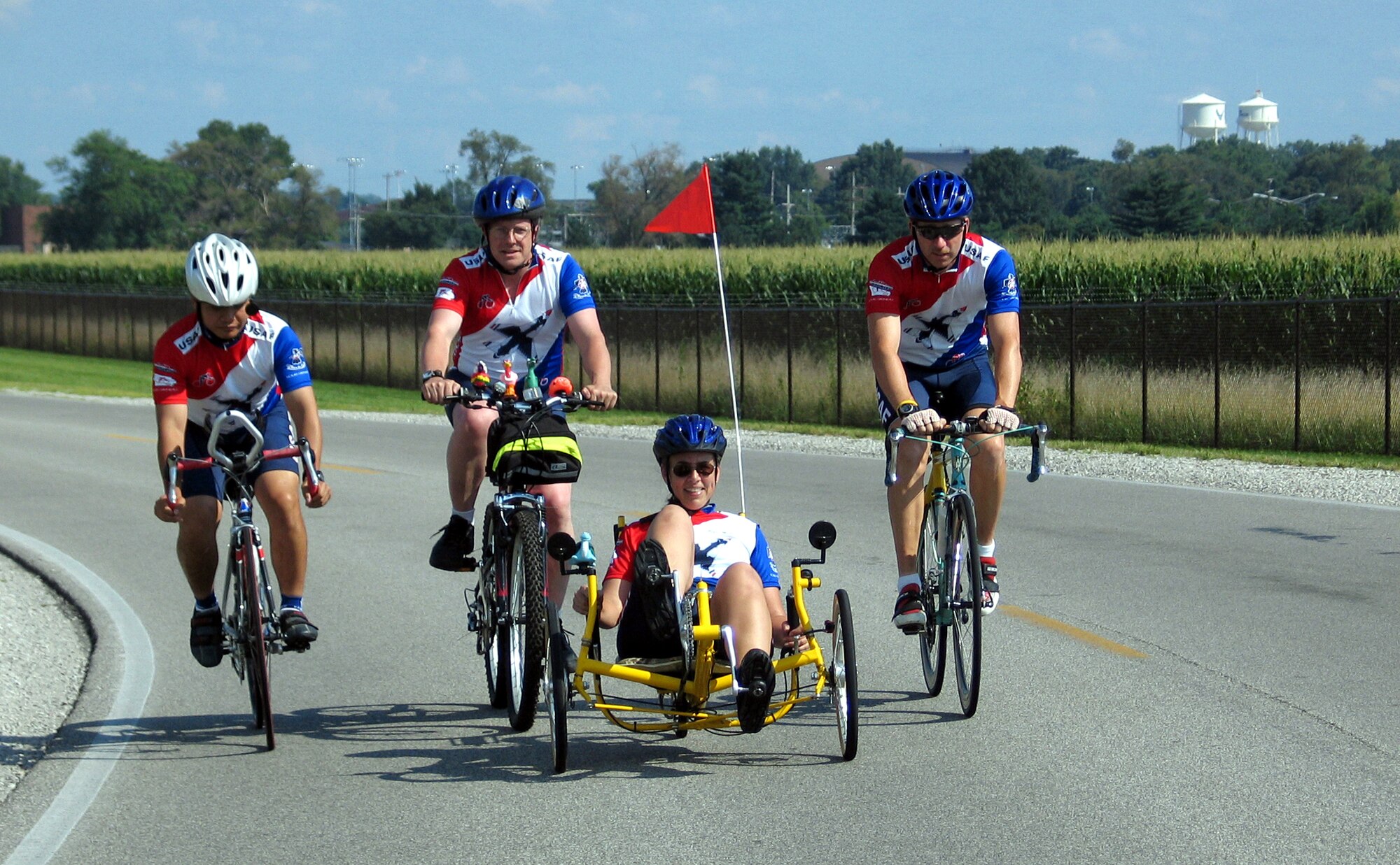 SCOTT AIR FORCE BASE, Ill. -- (From left to right) Capt. Wayne Yong, Ed Goreczny, Dr. Carol Belt and Tech. Sgt. Eric Wells take a ride here July 16 to prepare for the Des Moines Register's Annual Great Bicycle Ride Across Iowa.  The cyclists will join more than 100 other Air Force riders for the seven-day, nearly 500-mile ride July 25 to 31.  (U.S. Air Force photo by Tech. Sgt. Mark Diamond)
