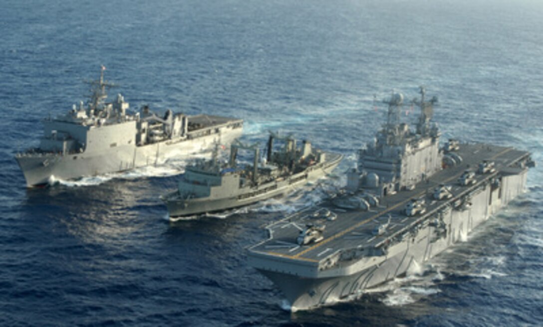USS Rushmore (LSD 47) (left), HMAS Success (AOR 304) (center) and USS Tarawa (LHA 1) conduct underway replenishment operations during Exercise Rim of the Pacific '04 on July 11, 2004. Exercise Rim of the Pacific '04 is an international maritime exercise designed to enhance the tactical proficiency of participating Pacific Rim nations including participants from Australia, Canada, Chile, Japan, South Korea, the United Kingdom, and the U.S. 