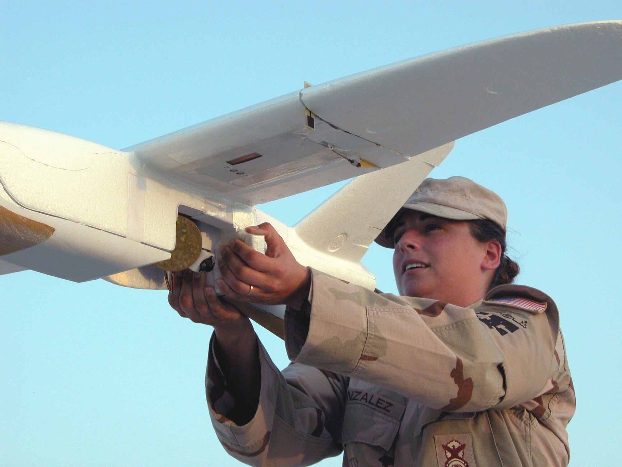 SOUTHWEST ASIA -- Staff Sgt. Nancy Gonzalez prepares to launch a Desert Hawk unmanned aerial vehicle.  Desert Hawk operators slingshot the craft into the air with a 50-foot bungee cord.  Sergeant Gonzalez is the noncommissioned officer in charge of the 379th Security Forces Squadron's airborne surveillance program and is deployed from Spangdahlem Air Base, Germany. (U.S. Air Force photo by Staff Sgt. C. Todd Lopez)  