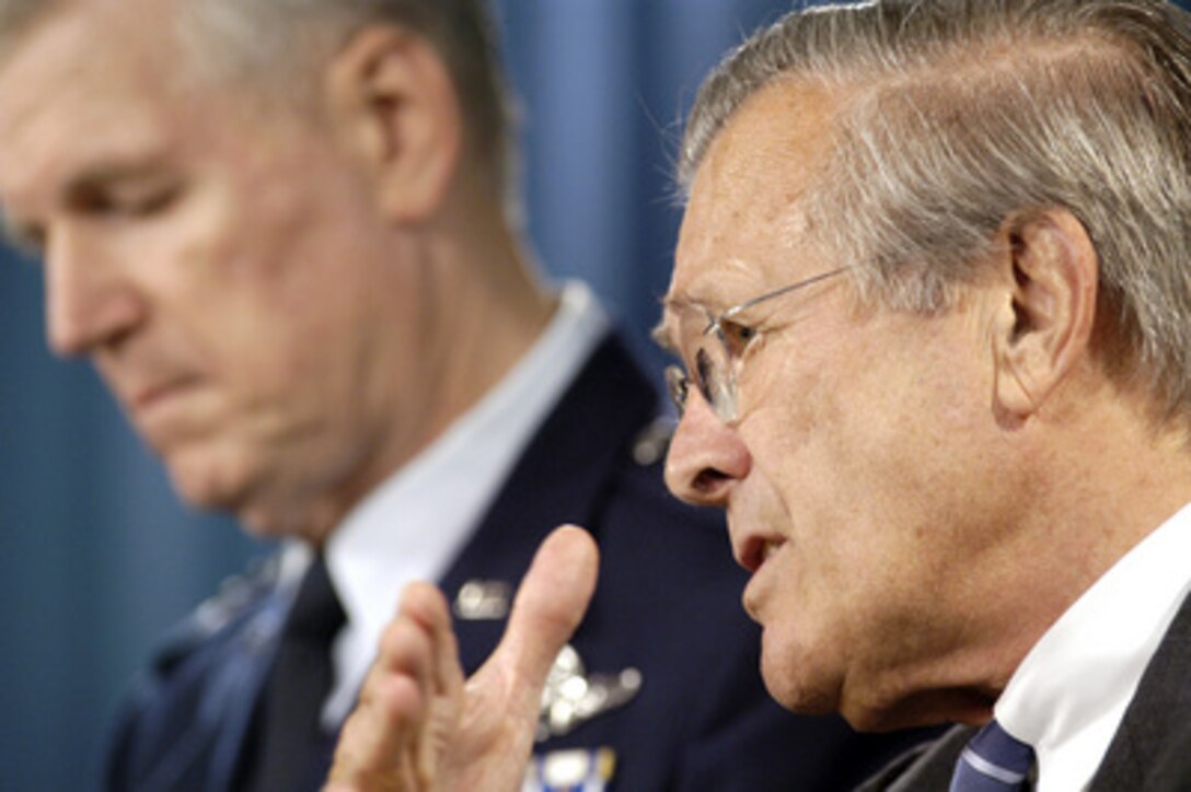 Secretary of Defense Donald H. Rumsfeld emphasizes a point at an operational update press briefing in the Pentagon on July 21, 2004. Rumsfeld was joined at the briefing by Chairman of the Joint Chiefs of Staff Gen. Richard B. Myers, U.S. Air Force. 