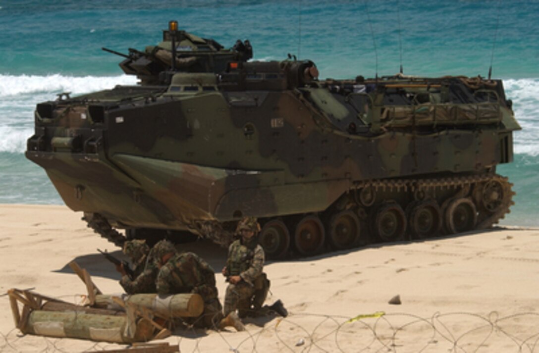 U.S. Marines guard their Amphibious Assault Vehicle following a mechanized raid during exercise Rim of the Pacific '04 on the Hawaiian Islands, on July 18, 2004. Exercise Rim of the Pacific '04 is an international maritime exercise designed to enhance the tactical proficiency of participating Pacific Rim nations including participants from Australia, Canada, Chile, Japan, South Korea, the United Kingdom, and the U.S. 