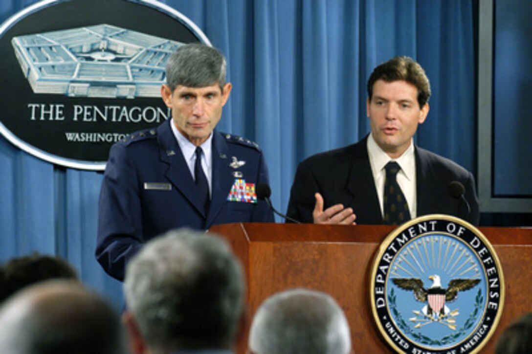Principal Deputy Assistant Secretary of Defense for Public Affairs Lawrence Di Rita (right) and Joint Staff Director for Operations Lt. Gen. Norton Schwartz (left), U.S. Air Force, respond to questions from reporters during a Pentagon press briefing on July 28, 2004. 