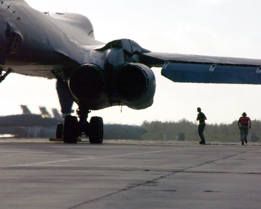 OPERATION ENDURING FREEDOM -- Crew chiefs prepare a B-1 Lancer for takeoff after the aircrew has boarded and started the engines.  They are in constant communication with the aircrew until the pilot begins taxiing.  (U.S. Air Force photo by Master Sgt. Sean Brennan)