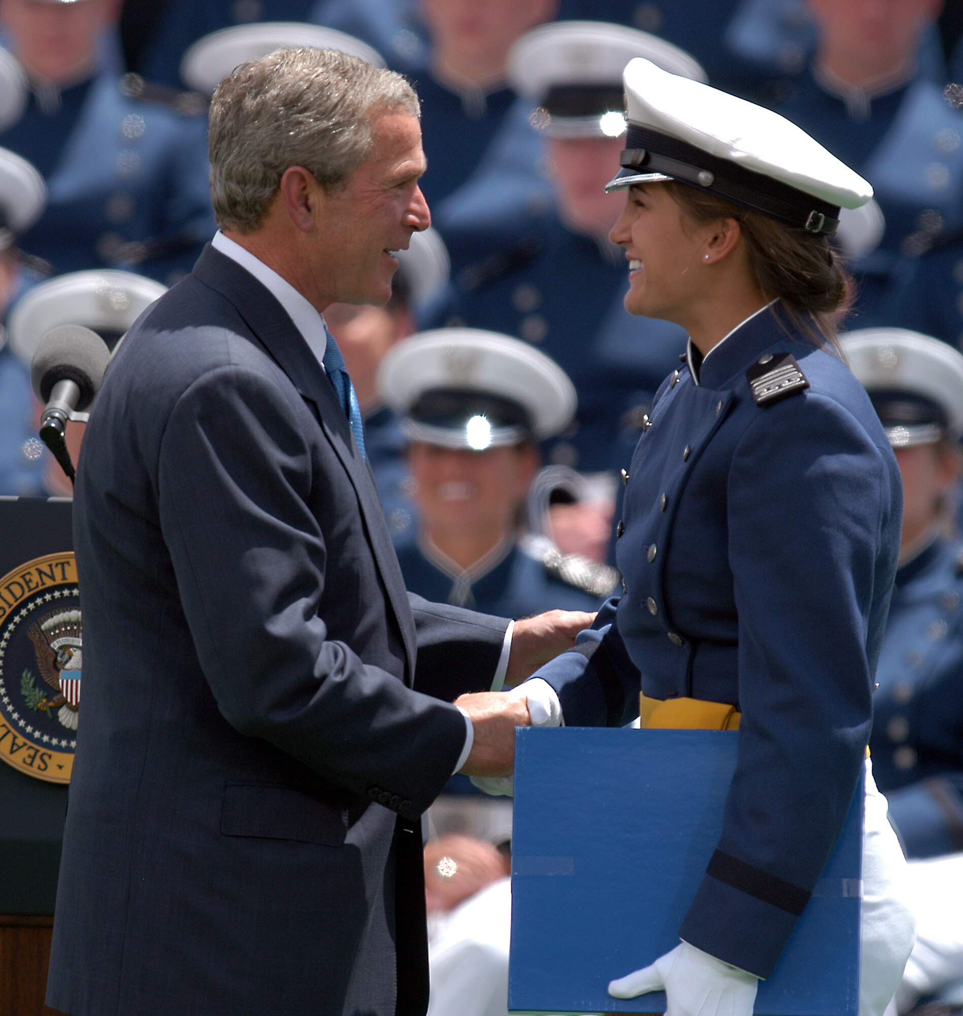 U.S. AIR FORCE ACADEMY, Colo. -- President Bush shares a moment with a graduate of the Class of 2004 following his commencement address here June 2.  (U.S. Air Force photo by Meggen Burghardt)