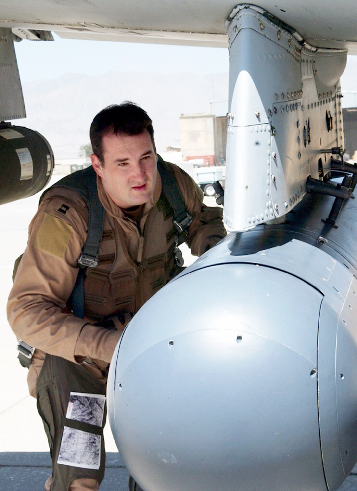 BAGRAM AIR BASE, Afghanistan -- Capt. Keith Wolak checks the Litening precision targeting pod on his A-10 Thunderbolt II before flying a mission from here.  He is an A-10 pilot assigned to the 355th Expeditionary Fighter Squadron supporting Operation Enduring Freedom.  (U.S. Air Force photo by Master Sgt. Andrew Gates)