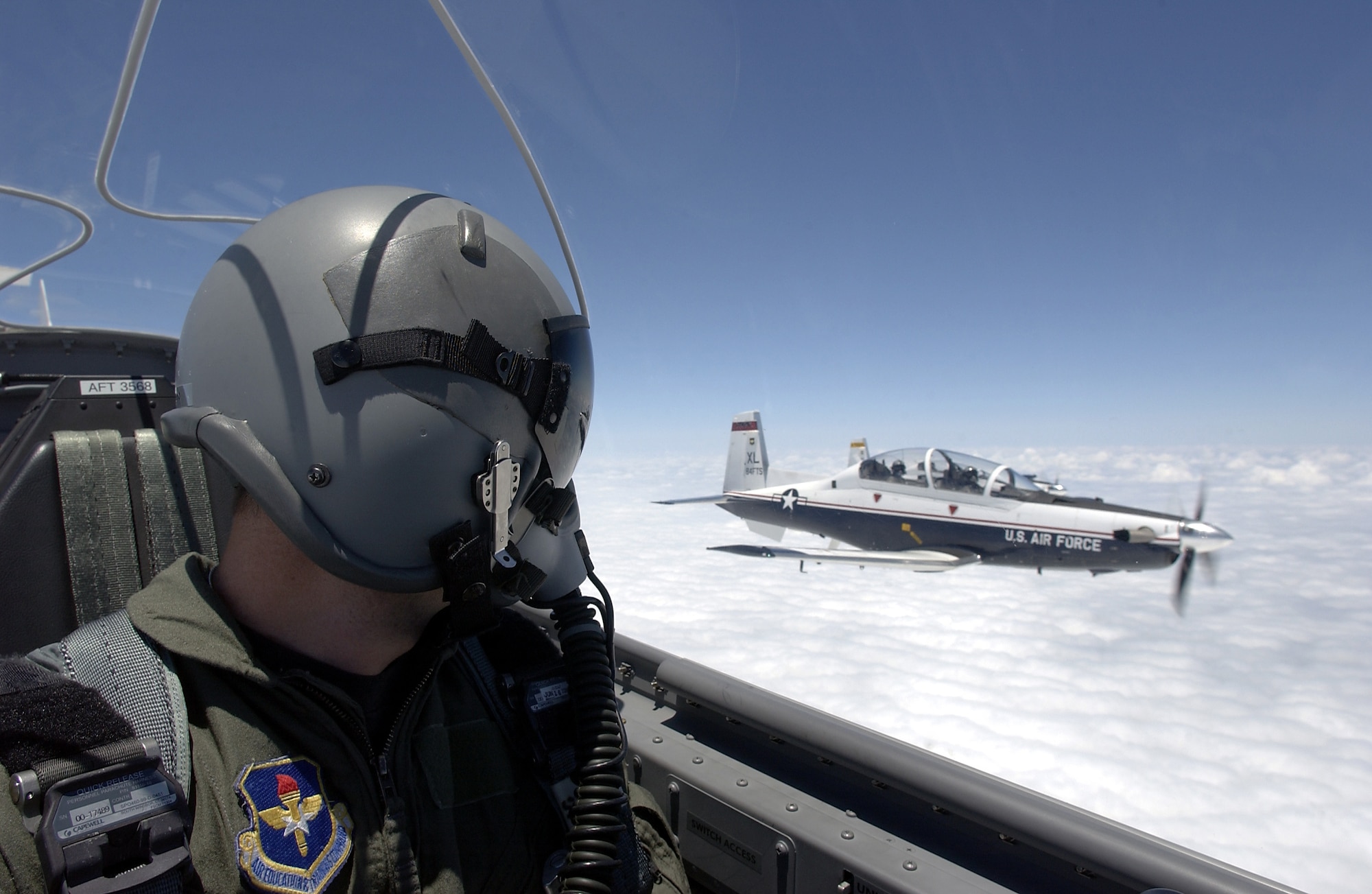 OVER LAUGHLIN AIR FORCE BASE, Texas -- A T-6A Texan II pilot flies in formation with another T-6A here May 19. The Texan II is replacing the T-37 Tweet as the primary trainer for Air Force pilots. (U.S. Air Force photo by Tech. Sgt. Jeffrey Allen)