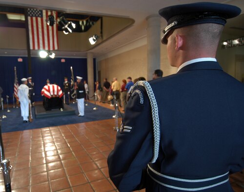 SIMI VALLEY, Calif. -- An Airman assigned to the U.S. Air Force Honor Guard at Bolling Air Force Base, D.C., stands watch as people pay their respects to former President Ronald Reagan at the Ronald Reagan Presidential Library here.  A state funeral takes place June 11 for President Reagan who died June 5.  (U.S. Navy photo by Petty Officer 1st Class Jon D. Gesch)
