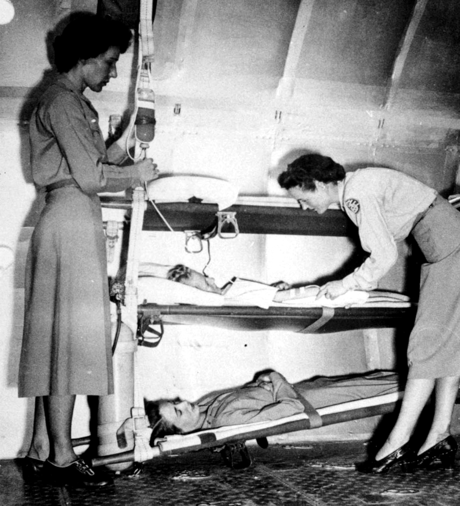 WORLD WAR II -- Although the role of the flight surgeon was developed in World War I, it was not until November 1942, when the School of Air Evacuation opened at Bowman Field, Ky., that the flight surgeon's counterpart -- the flight nurse -- became a member of the medical flight team.  Before World War II, no care was provided to wounded Soldiers during evacuation flights.  (Courtesy photo)
