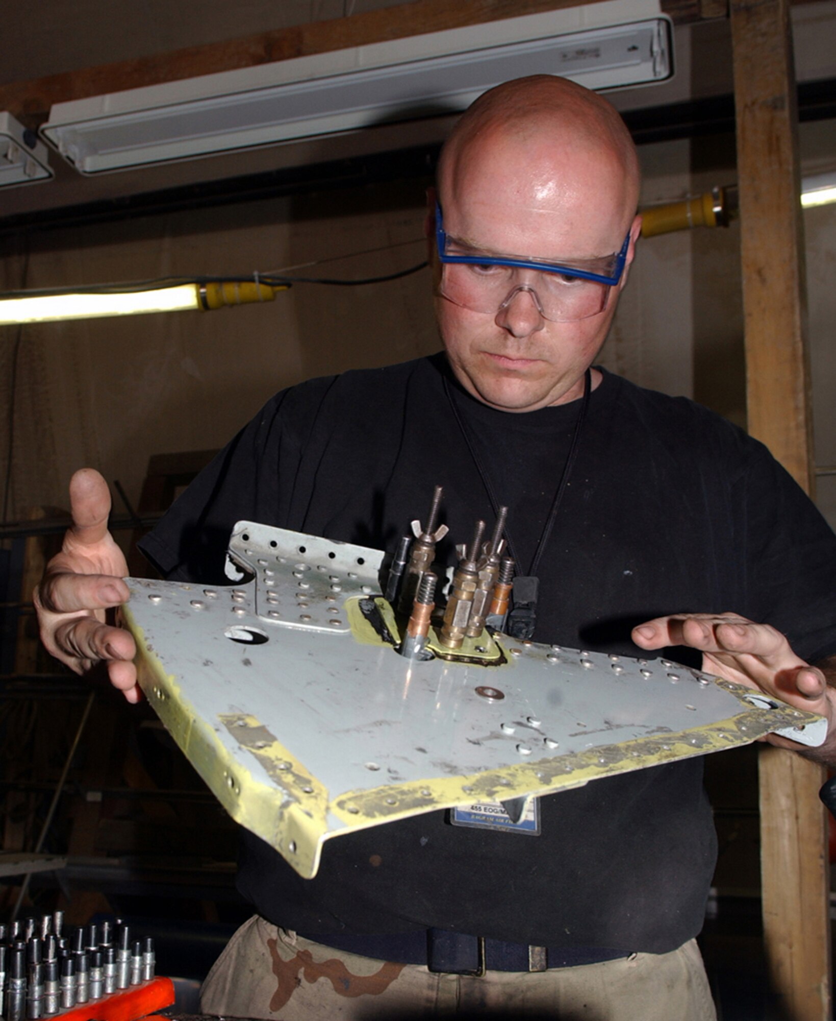 BAGRAM AIR BASE, Afghanistan -- Staff Sgt. Zabud Carper checks a repair to an A-10 Thunderbolt II slat rib.  The rib had a hairline crack that was discovered during an aircraft inspection.  Sergeant Carper is assigned to the 455th Expeditionary Aircraft Maintenance Squadron's fabrication branch here.  (U.S. Air Force photo by Master Sgt. Andrew Gates)