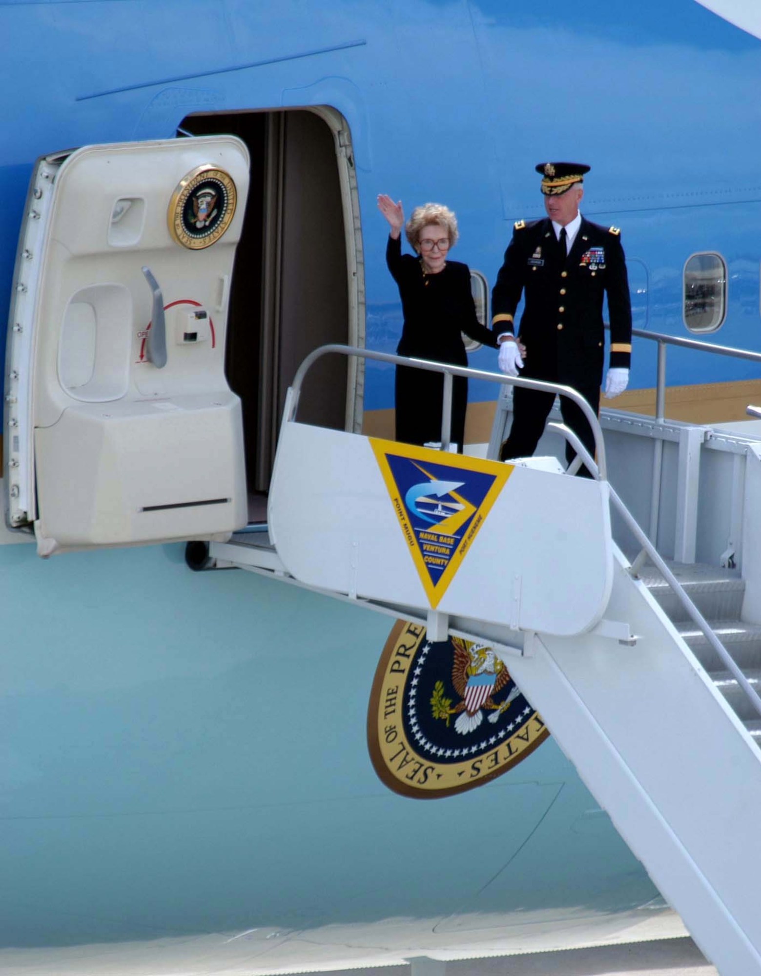 NAVAL BASE VENTURA COUNTY, Calif. -- Army Maj. Gen. Galen B. Jackman escorts former first lady Nancy Reagan as former President Ronald Reagan's casket is placed aboard an Air Force VC-25 here June 9.  President Reagan's body was flown to Andrews Air Force Base, Md., en route to Washington to lie in state in the U.S. Capitol Rotunda until June 11.  General Jackman is commander of the Military District of Washington.  (U.S. Navy photo by Petty Officer 1st Class Jon D. Gesch)