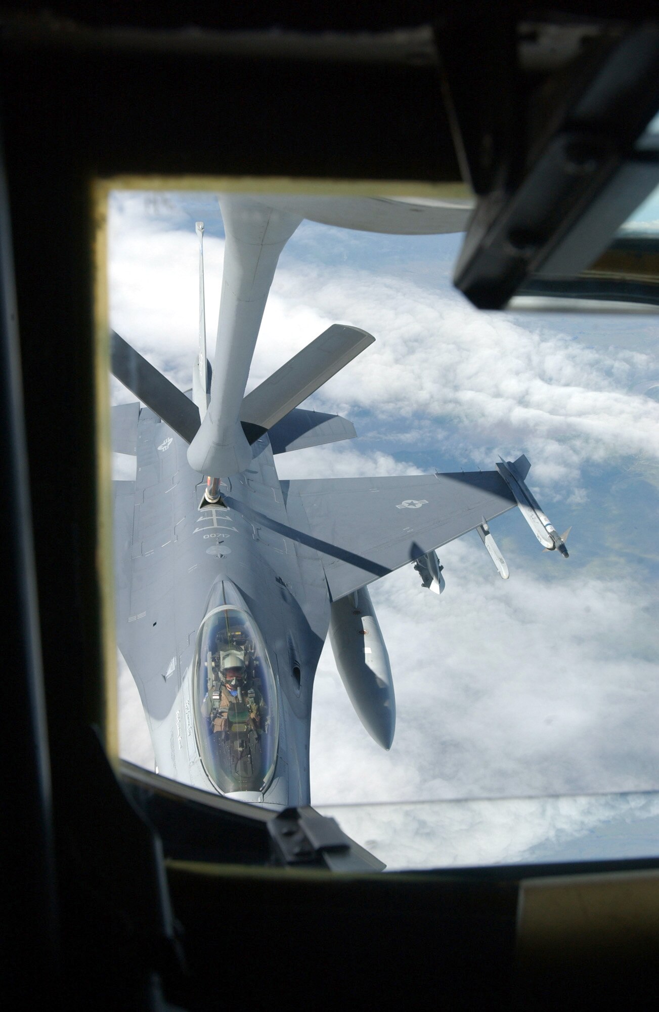 OVER ALASKA -- An F-16 Fighting Falcon from the 18th Fighter Squadron at Eielson Air Force Base, Alaska, receives fuel from a KC-135 Stratotanker from the Air National Guard's 126th Air Refueling Wing at Scott AFB, Ill., June 11 during Northern Edge '04.  The exercise is Alaska Command's joint training exercise designed to enhance interoperability among the services.  (U.S. Air Force photo by Senior Airman Joshua Strang)