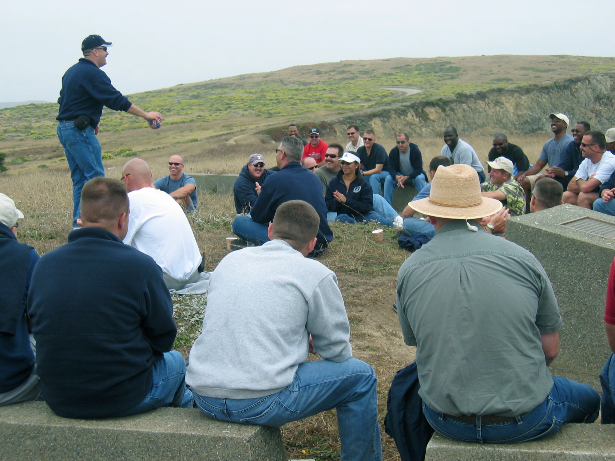 BODEGA BAY, Calif. -- An Air Force master sergeant tosses a ball to one of his fellow students here during a Coast Guard Chief Petty Officer's Academy outing.  A few Air Force senior noncommissioned officers attend each class to learn about leadership and teamwork from a different viewpoint while sharing their own experiences with the Coast Guardsmen.  (U.S. Air Force photo by 1st Lt. Shannon Nyberg)