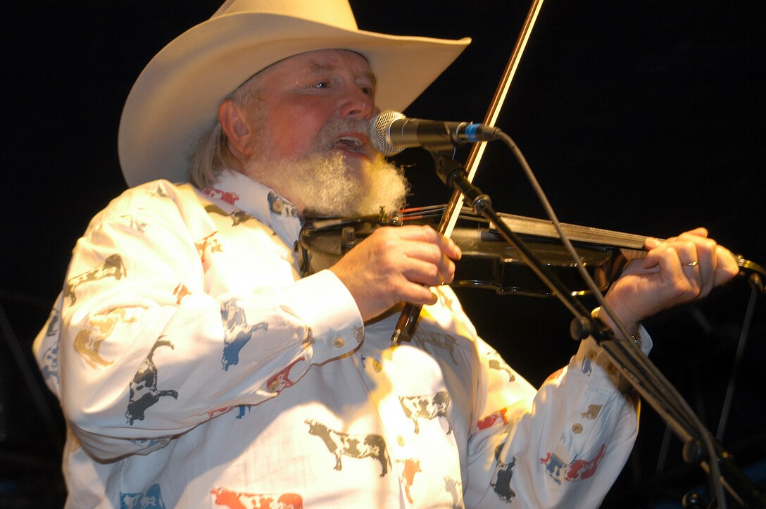 DYESS AIR FORCE BASE, Texas -- Country music artist Charlie Daniels performs his 1979 hit song, "The Devil Went Down to Georgia," for about 5,000 people here June 20.  Mr. Daniels performed the free concert as part of the "Spirit of America Tour," sponsored by a nonprofit organization that brings volunteer, headline entertainers to U.S. domestic military bases.  (U.S. Air Force photo by Airman 1st Class Kiley Olds)