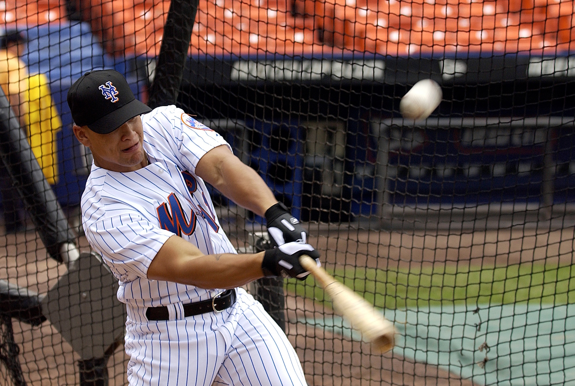 NEW YORK -- Senior Airman Chardo Richardson hits a ball in batting practice with the New York Mets on June 22.  He was at Shea Stadium for the second part of a job swap with Mets pitcher Al Leiter.  The pitcher was a boom operator for a day at McGuire Air Force Base, N.J., on May 24.  Airman Richardson is a boom operator with the 32nd Air Refueling Squadron at McGuire.  (U.S. Air Force photo by Kenn Mann)