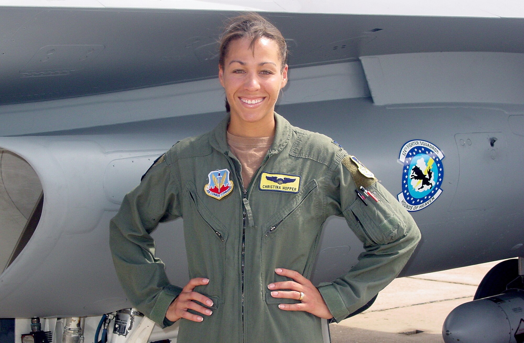 CANNON AIR FORCE BASE, N.M. -- Capt. Christina Hopper poses in front of an F-16 Fighting Falcon here.  She won Good Housekeeping magazine's Woman in Government Award for 2003 and will be featured in the magazine's July edition.  Captain Hopper is a pilot assigned to the 524th Fighter Squadron.  (U.S. Air Force photo by Airman 1st Class Dawn Kirton)