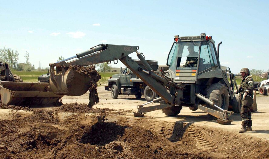 MINOT AIR FORCE BASE, N.D. -- Staff Sgt. Robert Finton repairs a simulated runway during an attack exercise here June 28.  The exercise simulated a bare-base environment to test the wartime skills of Airmen.  Sergeant Finton is assigned to the 5th Civil Engineer Squadron.  (U. S. Air Force photo by Airman 1st Class Fallon Shea)