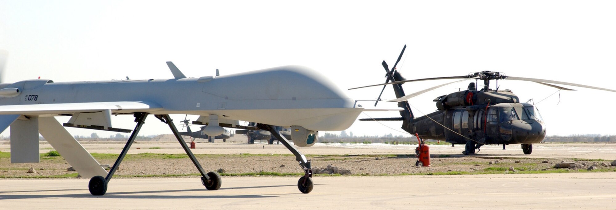 BALAD AIR BASE, Iraq -- An RQ-1 Predator unmanned aerial vehicle taxis to the runway before it begins a mission supporting Operation Iraqi Freedom.  (U.S. Air Force photo by Staff Sgt. C.E. Lewis)