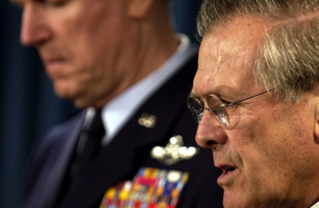 Secretary of Defense Donald H. Rumsfeld and Chairman of the Joint Chiefs of Staff Gen. Richard B. Myers conduct a joint press conference in the Pentagon on March 1, 2004. 
