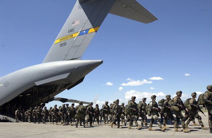 PORT-AU-PRINCE, Haiti -- Marines from Camp Lejeune, N.C., arrive here March 3.  They flew in a C-17 Globemaster III from Charleston Air Force Base, S.C.  (U.S. Air Force photo by Tech. Sgt. Andy Dunaway)