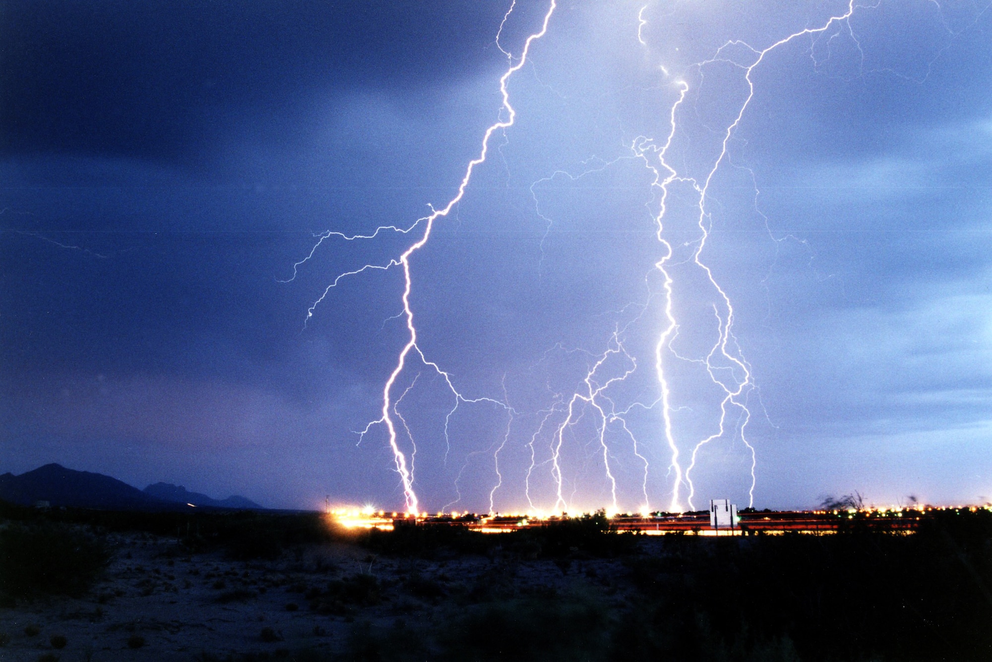 LAS CRUCES, N.M. -- Edward Aspera Jr. takes storm photos like this one of violent lightning.  He has been chasing storms since 1986 when he served in the Marine Corps, and he is now an audiovisual specialist with the 78th Air Base Wing at Robins Air Force Base, Ga.  (U.S. Air Force photo by Edward Aspera Jr.)
