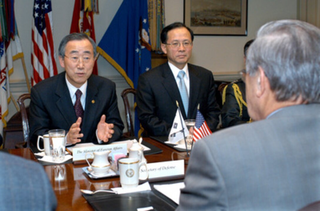 South Korean Minister of Foreign Affairs Ban Ki-moon (left) meets with Secretary of Defense Donald H. Rumsfeld (foreground) in the Pentagon on March 4, 2004. A range of bilateral security issues were expected to be discussed. Among those participating in the talks is Minister Ban's deputy Lee Soo Hyuck (center). 