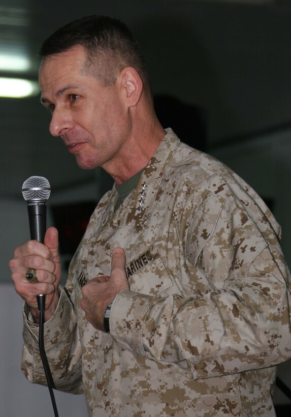 General Peter Pace, the first Marine chairman of the Joint Chiefs of Staff, speaks to service members at Al Asad, Iraq, New Year?s Day. Pace, along with entertainers from the United Services Organization, performed for Marines, Sailors and Soldiers who gathered at the Morale, Welfare and Recreation Center.
