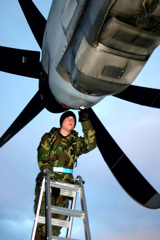 LITTLE ROCK AIR FORCE BASE, Ark. -- Senior Airman David Deutsh checks the intake of a C-130 Hercules J-model aircraft's propeller during a preflight inspection.  Six Guard, Reserve and active-duty flying units are participating in a monthlong procedures, development and evaluation test of the C-130J.  Airman Deutsh is a crew chief with the Air Force Reserve's 403rd Maintenance Squadron.  (U.S. Air Force photo by Maj. Nahaku McFadden)