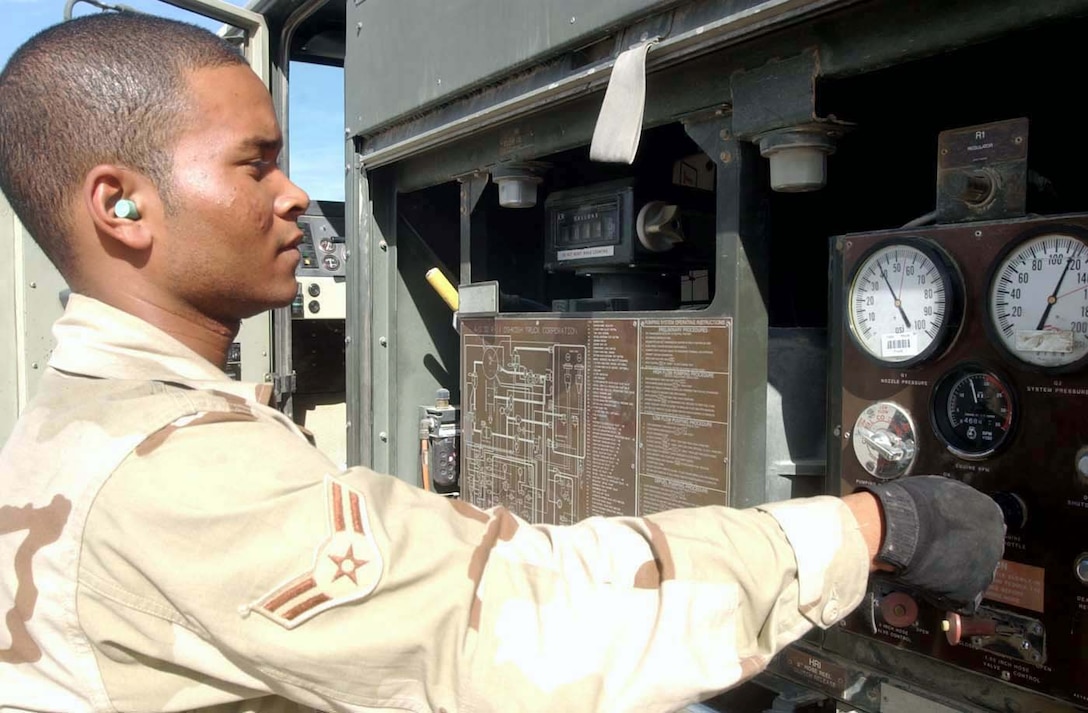 BAGRAM AIR BASE, Afghanistan -- Airman 1st Class Omar Foster adjusts the throttle on an R-11 refueling vehicle.  The R-11 can pump up to 600 gallons of jet fuel per minute.  Airman Foster is a fuels technician in the 455th Expeditionary Operations Group, and he is deployed from Hurlburt Field, Fla.  (U.S. Air Force photo by Master Sgt. Jeff Szczechowski)