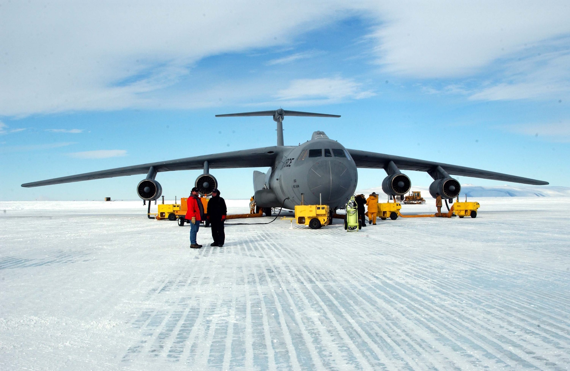 MCMURDO STATION, Antarctica -- A C-141 Starlifter sits here with engine heaters to keep mechanical parts from freezing up under the frigid condition.  Starlifters from the 445th Airlift Wing at Wright Patterson Air Force Base, Ohio, and the 452nd Air Mobility Wing at March Air Reserve Base, Calif., were here supporting Operation Deep Freeze.  (U.S. Air Force photo by Tech. Sgt. Joe Zuccaro)