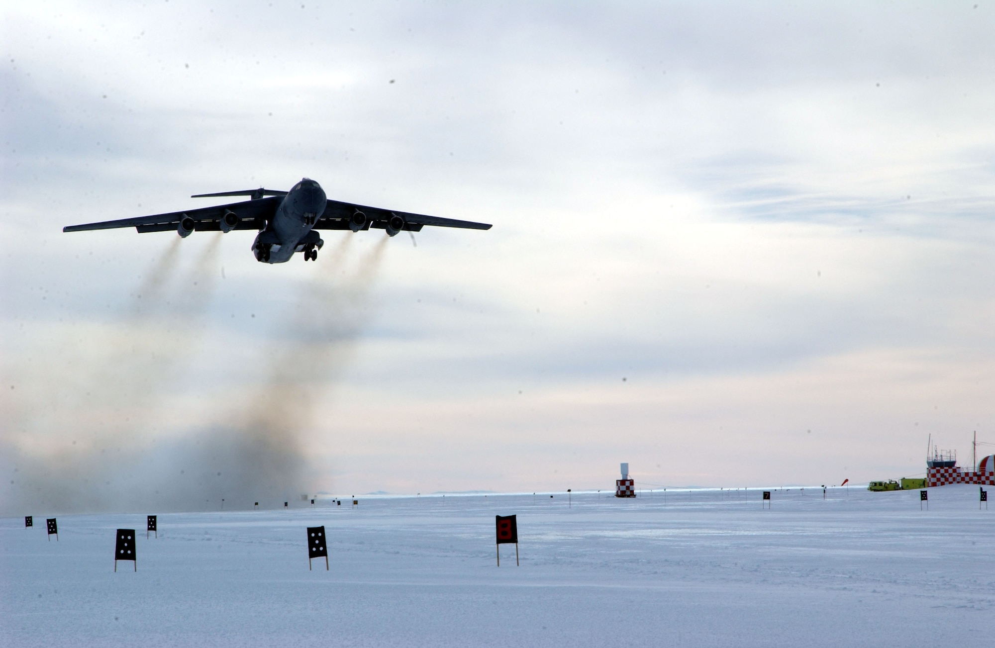 MCMURDO STATION, Antarctica -- A C-141 Starlifter takes off from here after delivering cargo and people for the National Science Foundation.  Starlifters from the 445th Airlift Wing at Wright Patterson Air Force Base, Ohio, and the 452nd Air Mobility Wing at March Air Reserve Base, Calif., were here supporting Operation Deep Freeze.  (U.S. Air Force photo by Tech. Sgt. Lee Harshman)