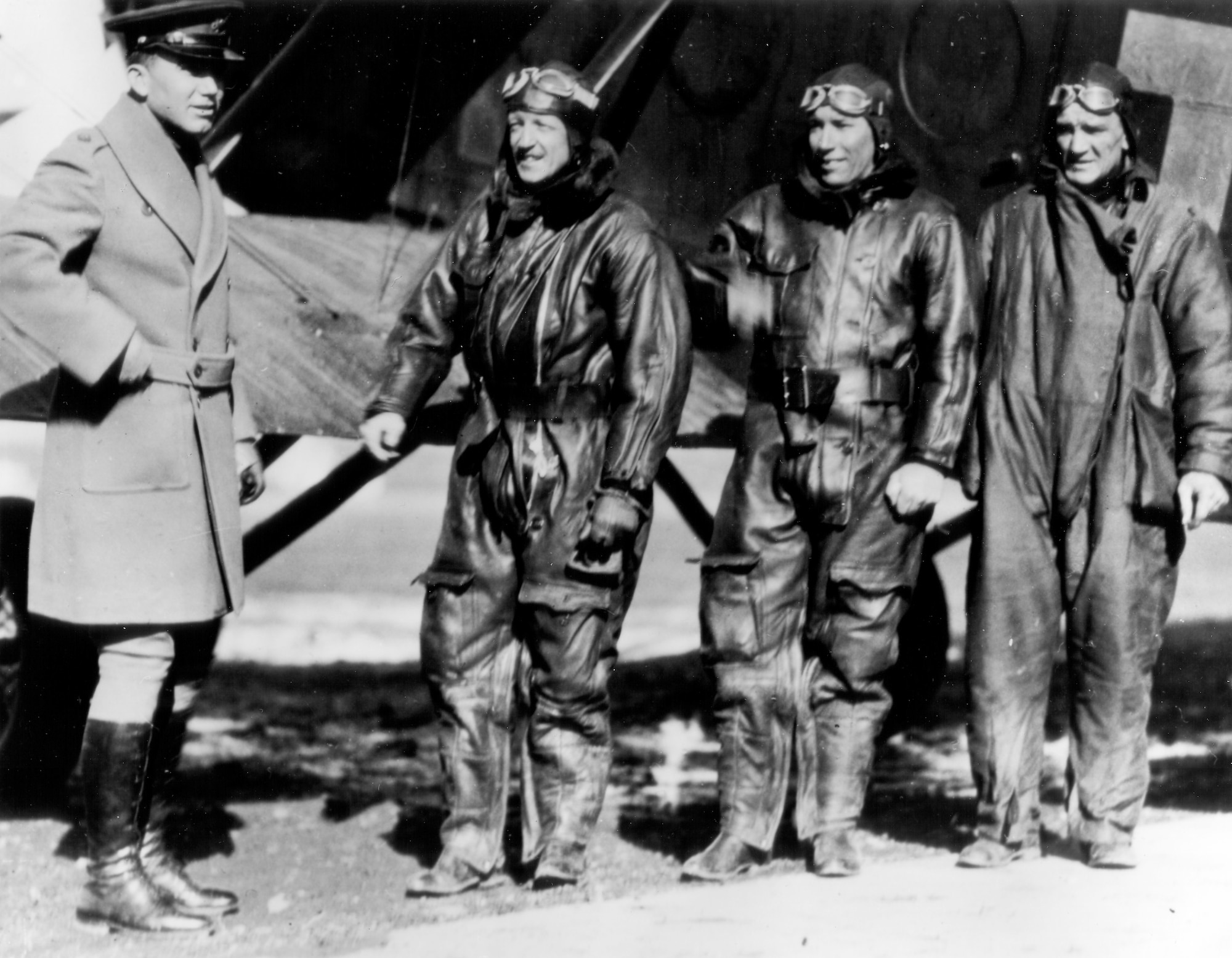 EARLY YEARS -- Flight of the "Question Mark" Crew - Major Howard C. Davidson, Commanding Officer, Bolling Field receiving Capt. Ross G. Hoyt, pilot of refueling plane number 1; Lt. Elwood R. Quesada and Master Sgt. Roy W. Hooe, members of the crew. (U.S. Air Force photo)
