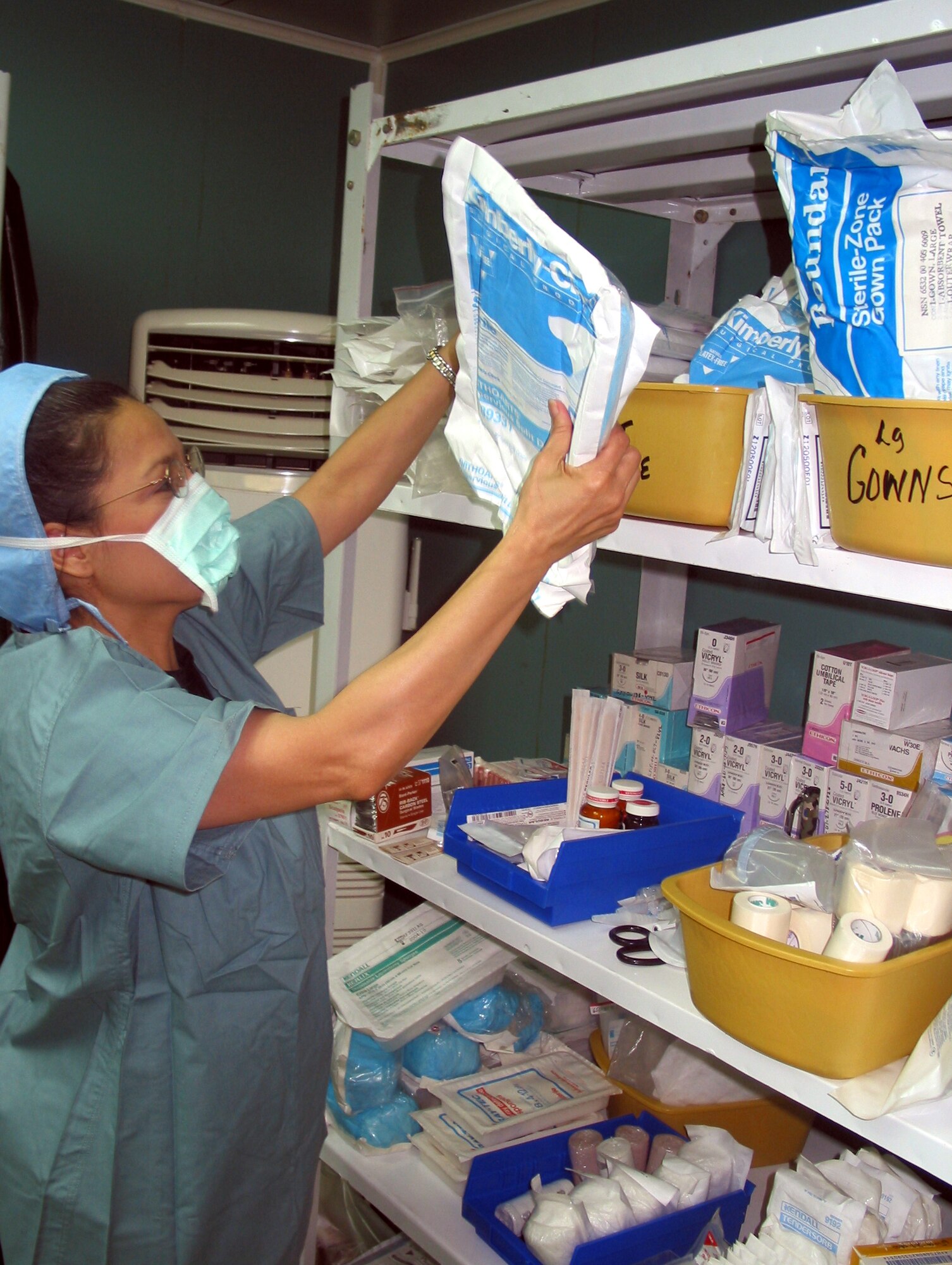 MANAS AIR BASE, Kyrgyzstan -- Maj. Delia Zorrilla checks surgical supplies.  She is part of the 376th Expeditionary Medical Group's surgical team.  (U.S. Air Force photo by Tech. Sgt. William J. Seabrook Jr.)