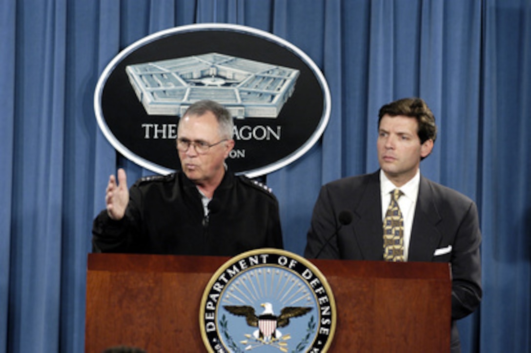 Commander, U.S. Southern Command Army Gen. James T. Hill (left) and Principal Deputy Assistant Secretary of Defense for Public Affairs Lawrence Di Rita give an operational update on Haiti at a Pentagon briefing on Mar. 10, 2004. Hill briefed the reporters on the deployment of the multinational interim force of U.S., Canadian, Chilean and French troops to expedite the security and stability of the country. 