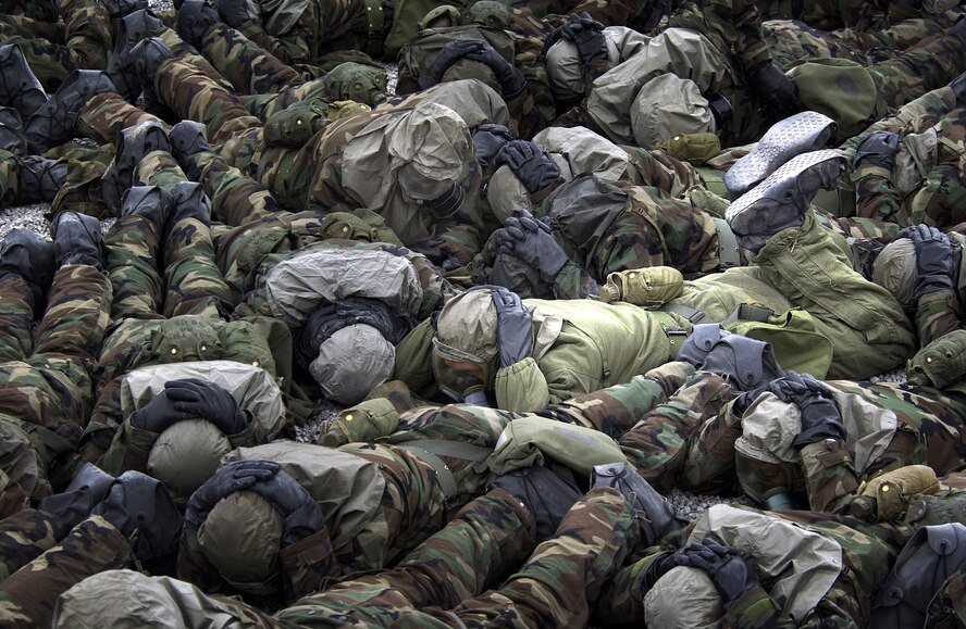 LACKLAND AIR FORCE BASE, Texas -- Basic trainees practice doning chemical warfare suits prior to entering the gas chamber as part of Warrior Week training here.  The training during Warrior Week prepares trainees for the possibility of world wide deployment almost immediately upon arrival at their first duty station.  The trainees are in their fifth week of training and are one week away from graduation.  (U.S. Air Force photo by Master Sgt. Efrain Gonzalez)
