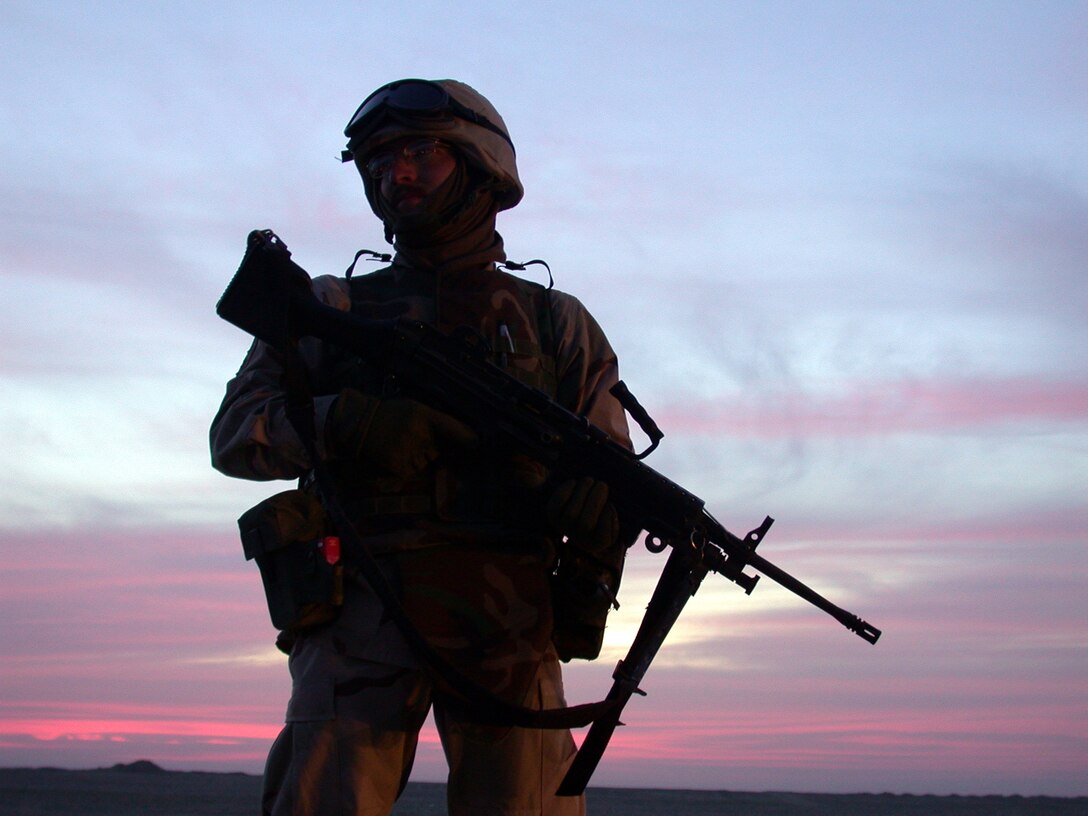 SOUTHWEST ASIA  --  Senior Airman Dustin Treadwell waits by for his convoy to depart March 8.  Airman Treadwell is deployed from Ramstein Air Base, Germany. (U.S. Air Force photo by Senior Airman James C. Dillard)