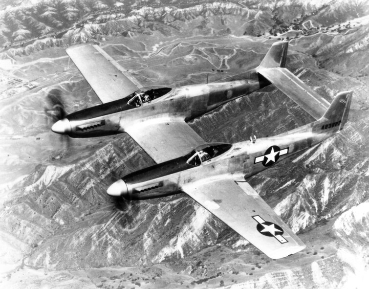 1940's -- NORTH AMERCIAN P-82, The Army Air Forces' "Twin Mustang" P-82, built by North American Aviation, prior to attempting to set a dual record for speed and fighter endurance on a 5,000 mile flight from Hawaii to New York.  The plane was constructed by joining two P-51 fuselages to a single wing.  It had a top speed of 475 miles per hour, with a wing span of 51 feet, three inches, and was 38 feet, one inch long.  It carried two pilots, one in each cockpit, and was equipped with an automatic pilot, and a pulsating seat to eliminate pilot fatique on long range flights. (U.S. Air Force photo)