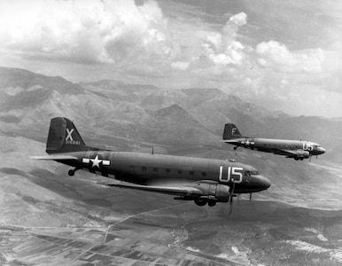 1940's -- Douglas C-47 "Skytrains", 12th Air Force Troop Carrier Wing, loaded with paratroopers on their way for the invasion of southern France, 15 August 1944. (U.S. Air Force photo)