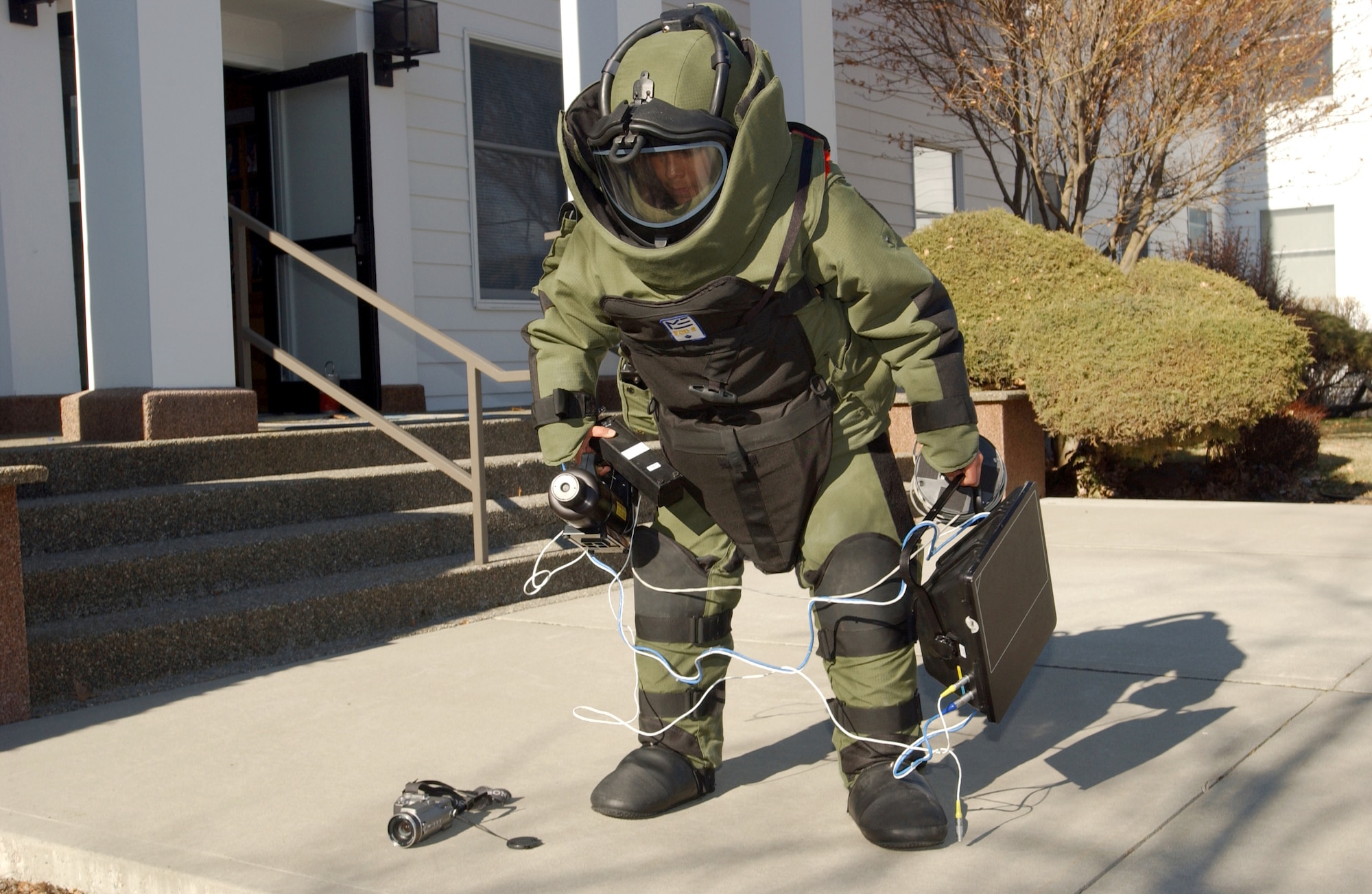 FAIRCHILD AIR FORCE BASE, Wash. (AFPN) -- Senior Airman Sarah Martinez prepares to enter a building where a simulated suspect device was found during an exercise here March 9.  Airman Martinez is an explosive ordnance disposal technician with the base's 92nd Civil Engineer Squadron.  (U.S. Air Force photo by Staff Sgt. Laura K. Smith)