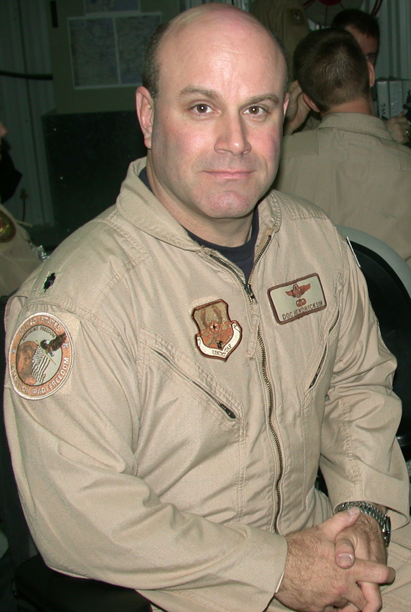 SOUTHWEST ASIA -- Lt. Col. Bruce Hendrickson works directly to support operations Iraqi Freedom and Enduring Freedom, and Joint Task Force-Horn of Africa with airlift and air refueling taskings.  He is the night chief for the Combined Air Operations Center's air mobility division.  (U.S. Air Force photo by Staff Sgt. Monte J. Volk)