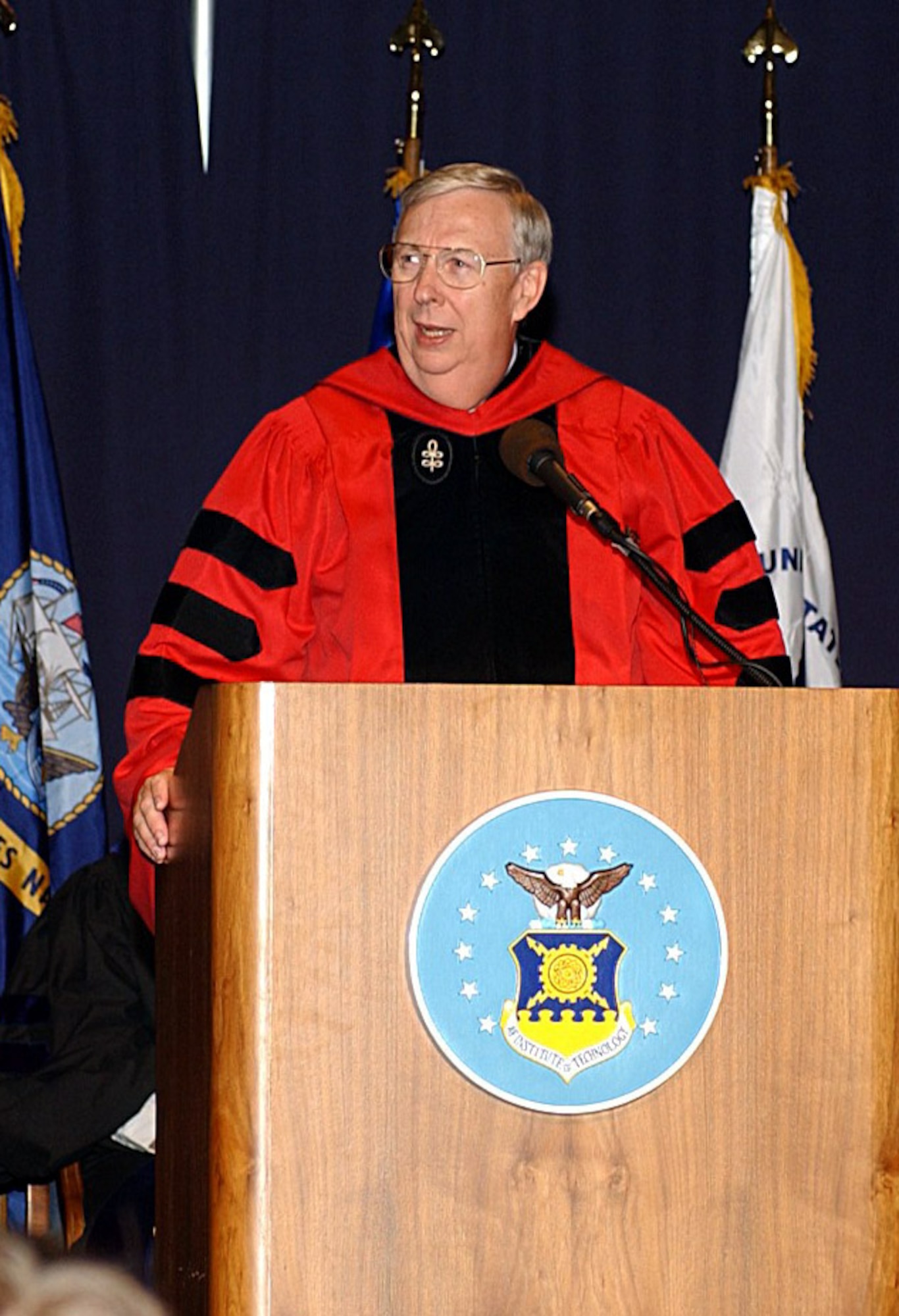 DAYTON, Ohio -- Secretary of the Air Force Dr. James G. Roche addresses the Air Force Institute of Technology graduating Class of 2004 March 23 at the Air Force Museum here.  (U.S. Air Force photo by Larry Davenport)