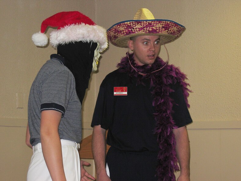 LACKLAND AIR FORCE BASE, Texas -- Staff Sgt. Ricky Hendricks Jr. (right) performs a skit with a Tops in Blue member "from another planet."  He was auditioning in the specialty category during the 2004 Air Force Worldwide Talent Contest that ran March 14 to 22.  Sergeant Hendricks is from F.E. Warren Air Force Base, Wyo.  (U.S. Air Force photo by Senior Airman Catharine Schmidt)