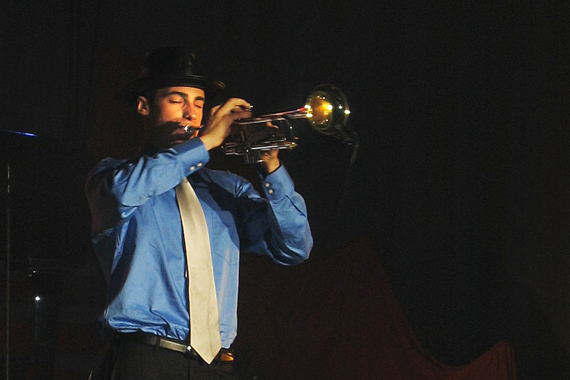LACKLAND AIR FORCE BASE, Texas -- Airman Joshua Phipps plays a trumpet March 19 during the 2004 Air Force Worldwide Talent Contest here.  He competed against about 70 contestants for a shot at joining the 2004 Tops in Blue tour.  Airman Phipps is from Beale Air Force Base, Calif.  (U.S. Air Force photo by Senior Airman Catharine Schmidt)