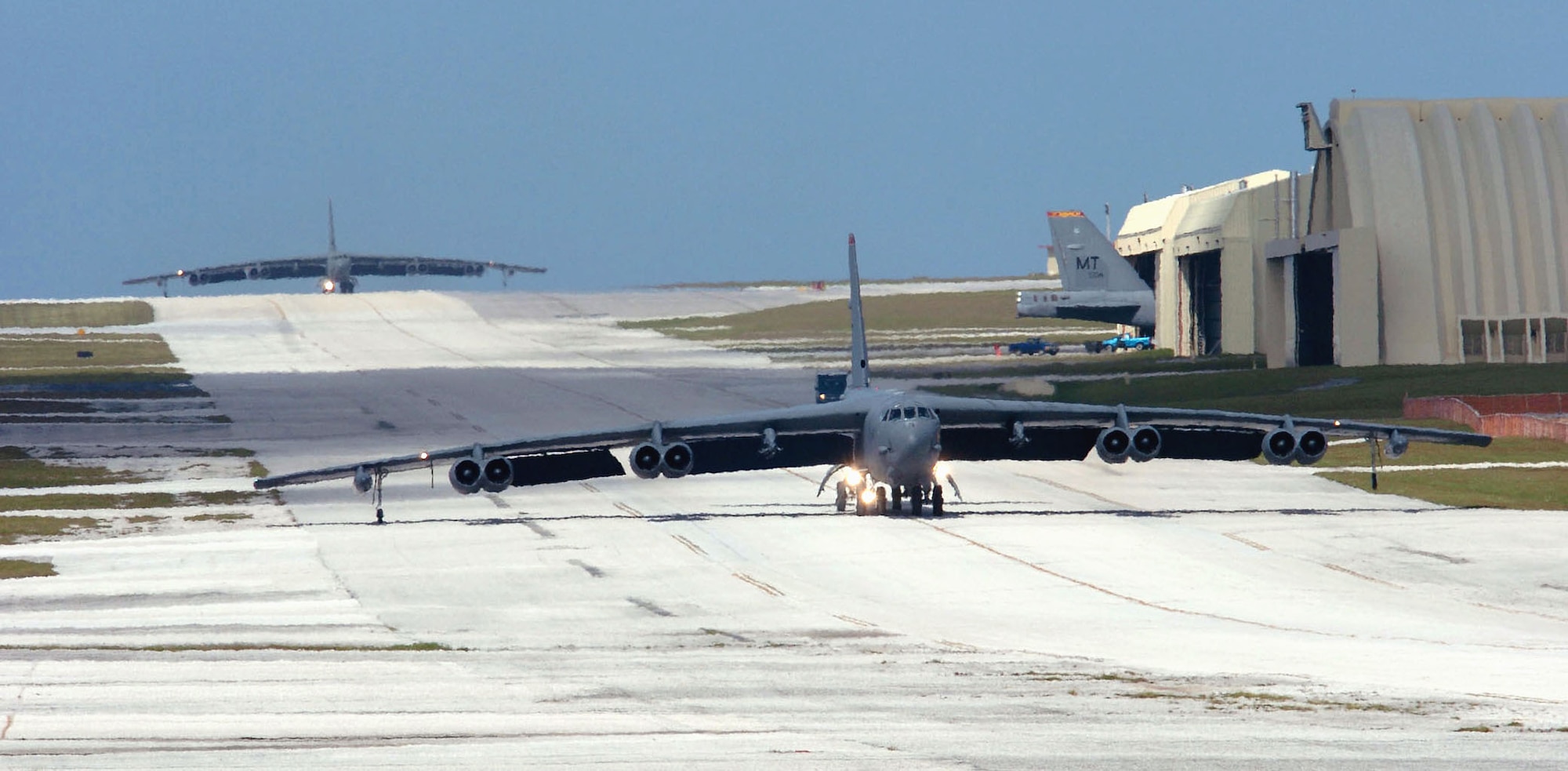 ANDERSEN AIR FORCE BASE, Guam -- Two B-52 Stratofortress aircraft and crews from the 5th Bomb Wing at Minot Air Force Base, N.D., return here from a mission.  The wing is the first rotation to deploy to Guam following the decision to station a bomber force here.  (U.S. Air Force photo by Master Sgt. Val Gempis)