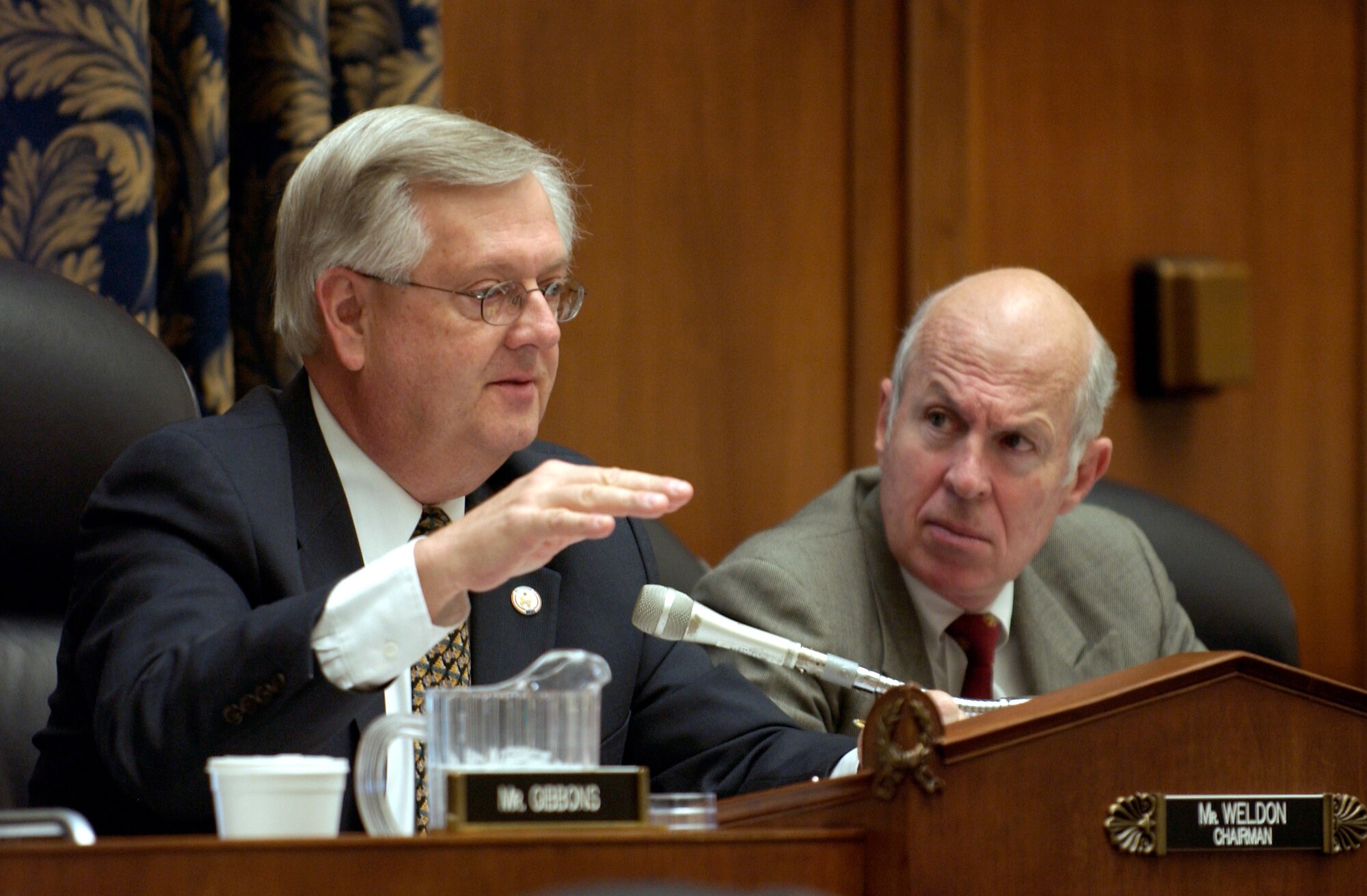 WASHINGTON -- Subcommittee chairman Rep. Curt Weldon (left) asks questions about the state of the F/A-22 and Joint Strike Fighter programs during a hearing of the House Armed Services Committee subcommittee on tactical air and land forces March 25.  (U.S. Air Force photo by Master Sgt. Jim Varhegyi)