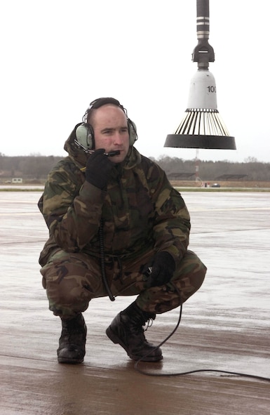 ROYAL AIR FORCE FAIRFORD, England -- Staff Sgt. Matthew Gniotczynski waits near the tail of a KC-135 Stratotanker for the aircrew to begin a flight controls check.  The aircraft is from the 351st Expeditionary Air Refueling Squadron at Royal Air Force Mildenhall.  The 351st EARS will fly out of the airstrip here while Mildenhall's runway is under construction.  Sergeant Gniotczynski is a crew chief with the 351st Expeditionary Maintenance Squadron.  (U.S. Air Force photo by Master Sgt. John E. Lasky)