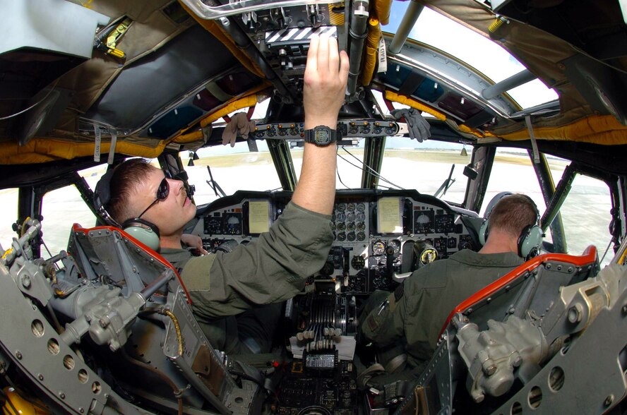 ANDERSEN AIR FORCE BASE, Guam -- Capt. Jeremiah Baldwin (left), a pilot, and 1st Lt Bentley Brooks, a co-pilot, conduct a preflight check in their B-52 Stratofortress here.  Six B-52s and about 300 support people from Minot Air Force Base, N.D., are the first to deploy here following the decision to station a rotating bomber force here.  Both Airmen are from the 23rd Bomb Squadron at Minot AFB.  (U.S. Air Force photo by Master Sgt. Val Gempis)